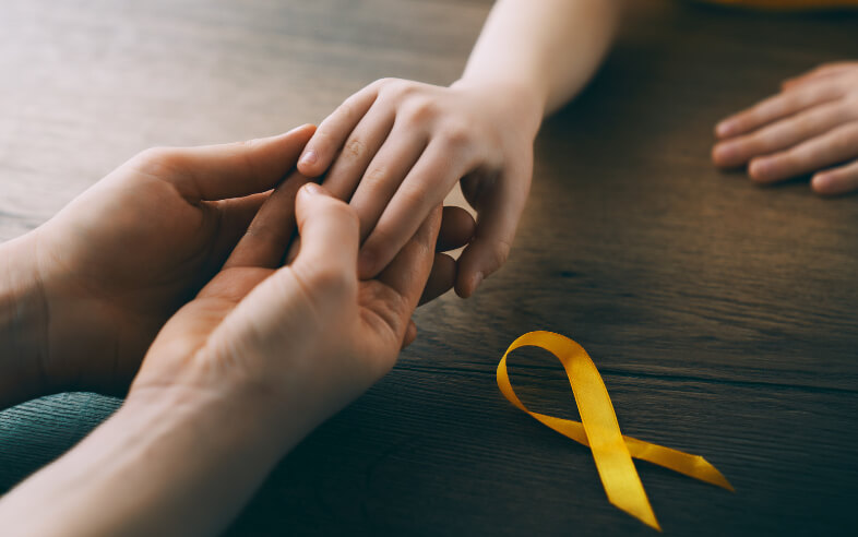 Elderly woman shaking hands with man sitting on couch